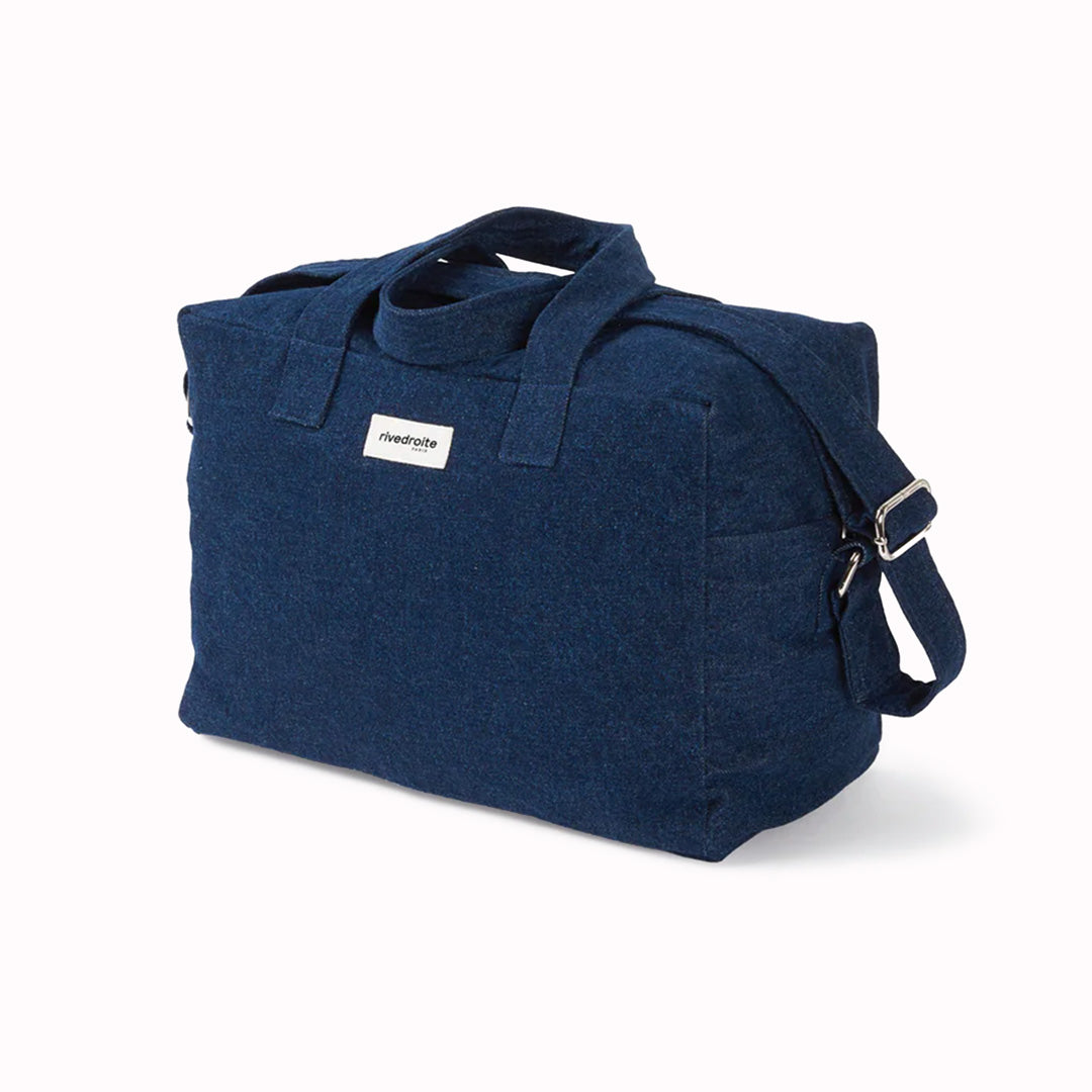 Raw Denim Sauval bag from Parisian brand Rive Droite is a compact everyday messenger bag made from recycled cotton. Viewed from an angle