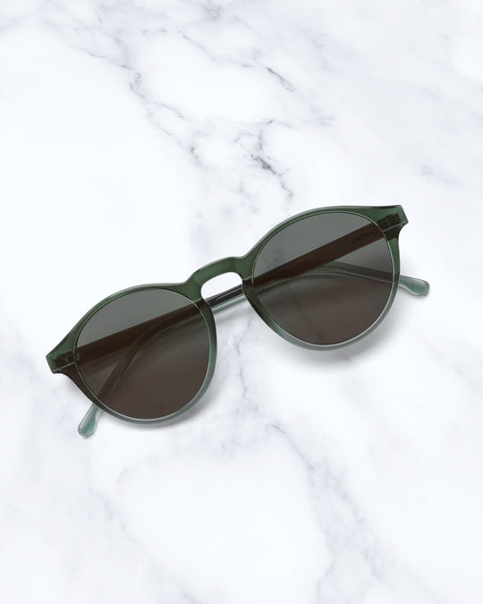 The Devon is one of Komonos' most popular styles. It has rounded shape with a slight cats eye and the Tealscape has a combination of gradient green frame and green lenses.