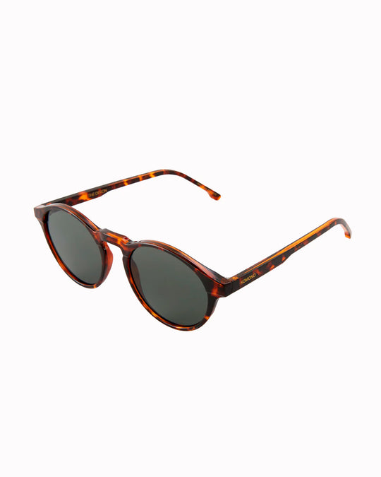 The Devon is one of Komonos' most popular styles. It has rounded shape with a slight cats eye and the Tortoise has a combination of tortoiseshell frame and solid grey lenses.