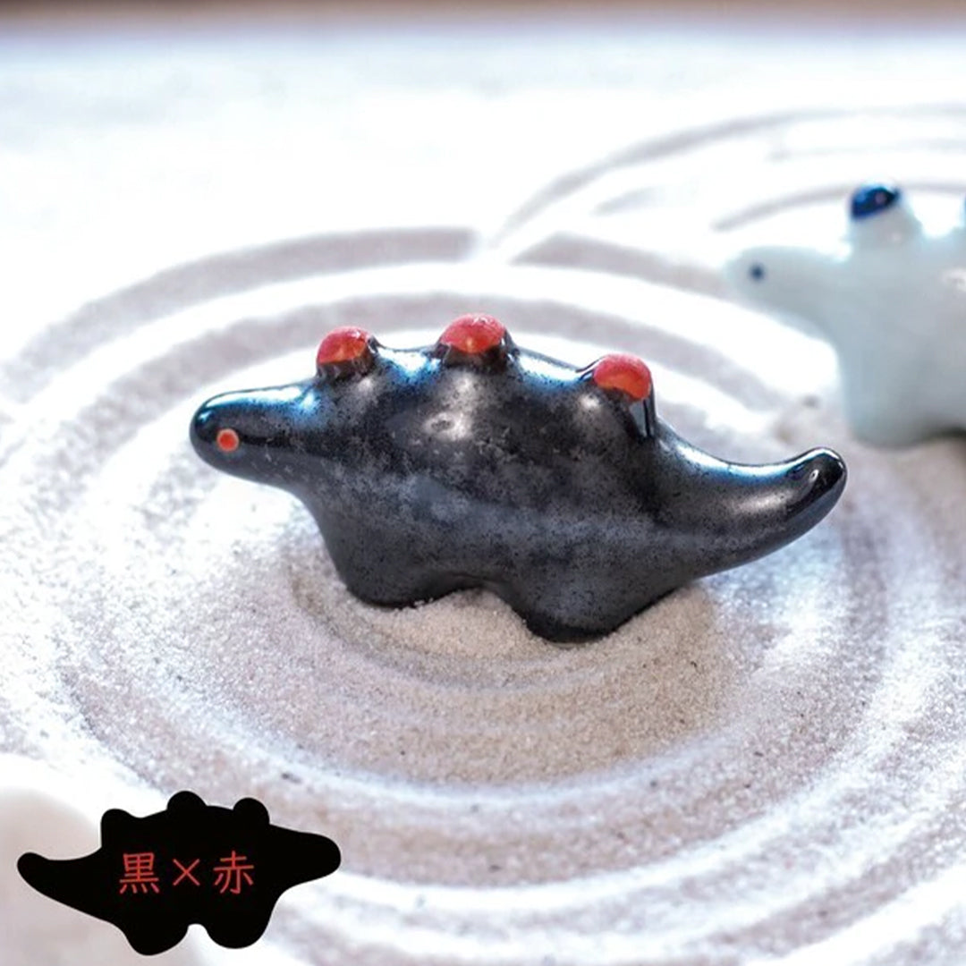 Dinosaur shaped chopstick rest made from 'Minoyaki' porcelain, fired at a high temperature and hand finished in Gifu prefecture, Japan.