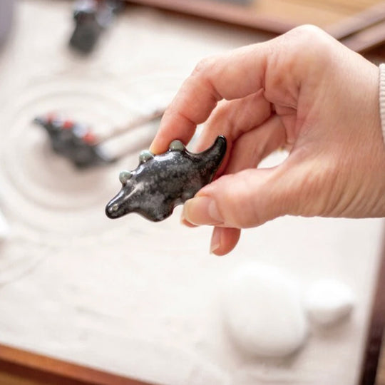 Dinosaur shaped chopstick rest made from 'Minoyaki' porcelain, fired at a high temperature and hand finished in Gifu prefecture, Japan.