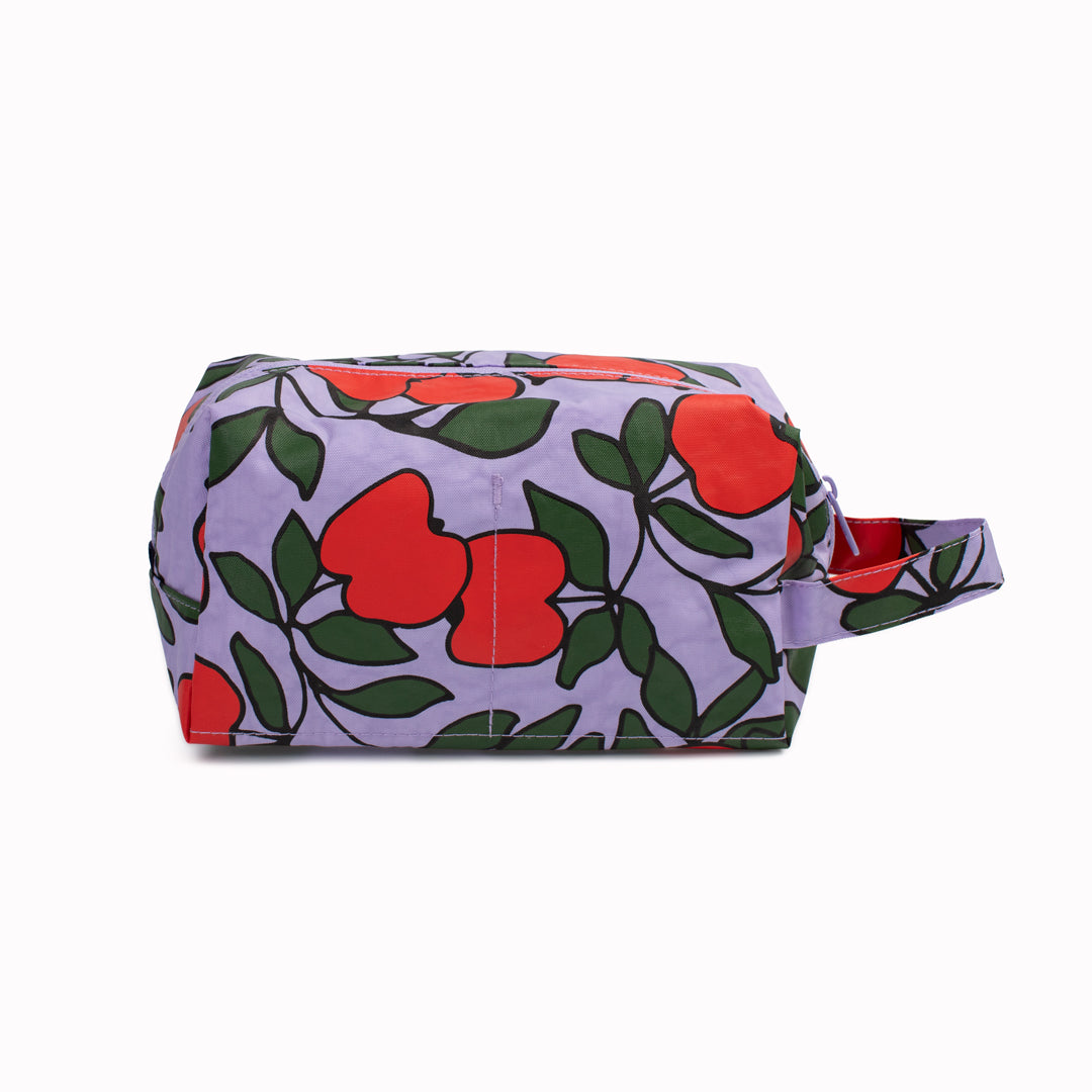 Vibrant Apple Tree design Dopp Kit toiletries bag by Baggu for all your travel essentials. Cube shaped pouch with full zip opening for easy access and visibility of your cosmetics and toiletries.&nbsp;
