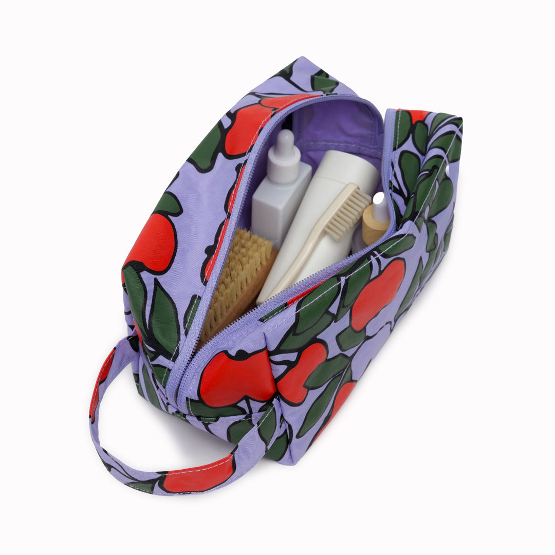 Vibrant Apple Tree design Dopp Kit toiletries bag by Baggu for all your travel essentials. Cube shaped pouch with full zip opening for easy access and visibility of your cosmetics and toiletries.&nbsp;