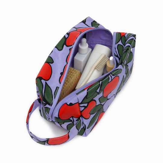 Vibrant Apple Tree design Dopp Kit toiletries bag by Baggu for all your travel essentials. Cube shaped pouch with full zip opening for easy access and visibility of your cosmetics and toiletries.&nbsp;