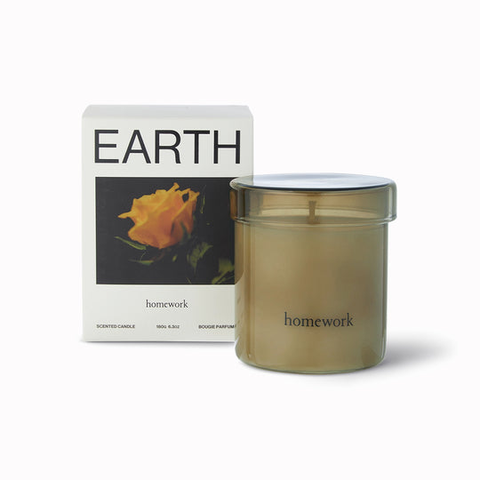 Homework candle with 'Earth' packaging featuring a rose on a white background