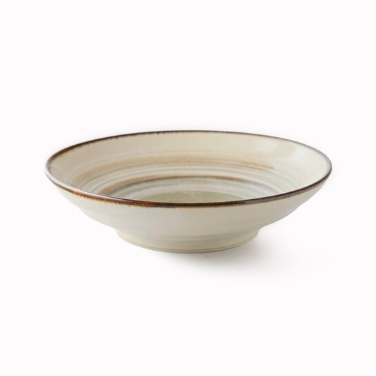 Shallow noodle bowl with irregular earthy toned swirl pattern on a cream glazed base. Diameter 23cm and height approx 5cm.