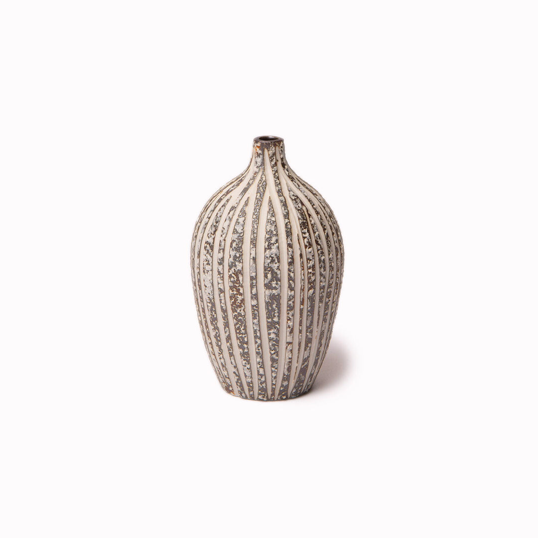 The Elisa ceramic vase by Lindform with their Stone Stripe glaze is a charming decorative vase that looks beautiful as a neutral decorative object on its own