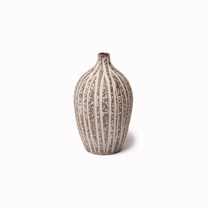 The Elisa ceramic vase by Lindform with their Stone Stripe glaze is a charming decorative vase that looks beautiful as a neutral decorative object on its own