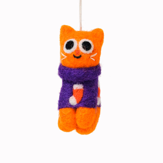 Esther the cat loves their festive Christmas jumper! She is a playful felted Christmas tree decoration designed by Elliot Kruszynski.
