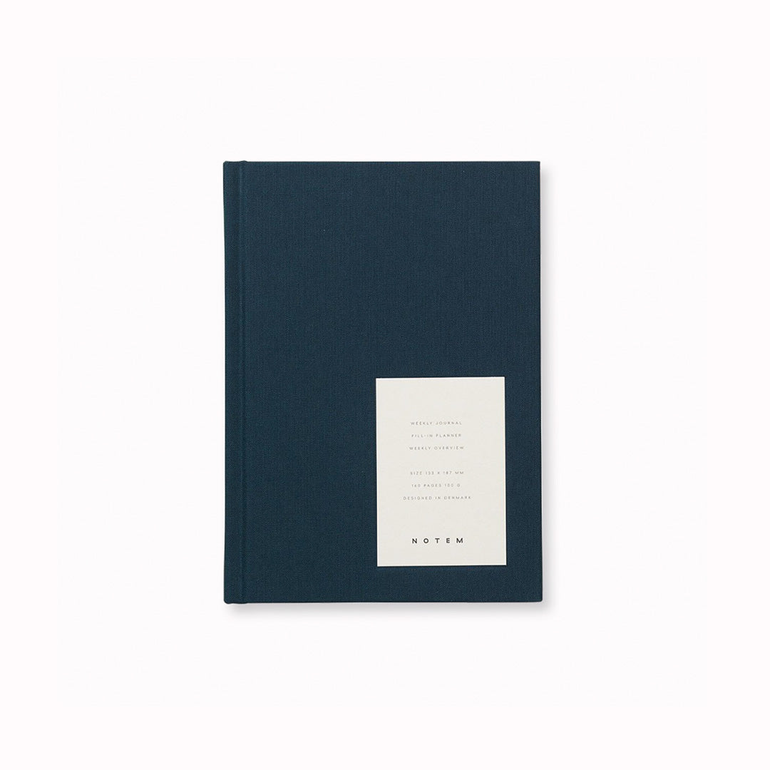 Notem Even Weekly Journal, This A6 Dark Blue journal has 160 pages of high-quality uncoated lined paper with dates on the left and notes on the right hand side, it also has a Ribbon Marker.