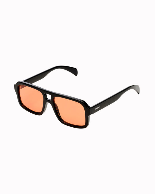 The Falcon strips things back to a slim rectangular frame with a lighter, sharper profile than KOMONO’s heavier acetate styles.