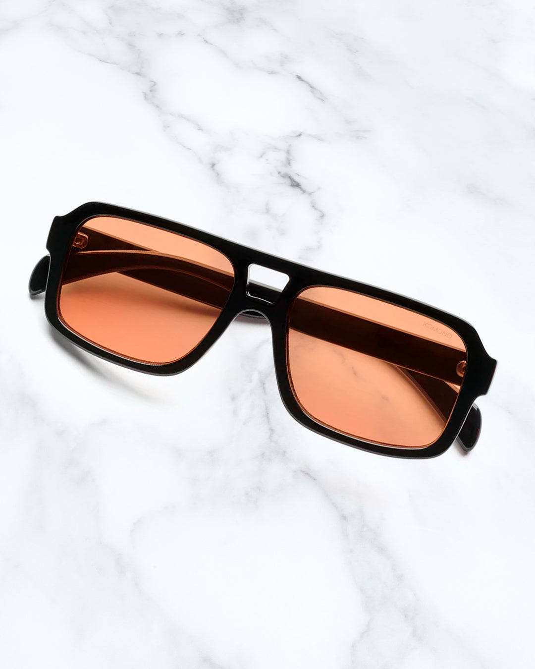 The Falcon strips things back to a slim rectangular frame with a lighter, sharper profile than KOMONO’s heavier acetate styles.