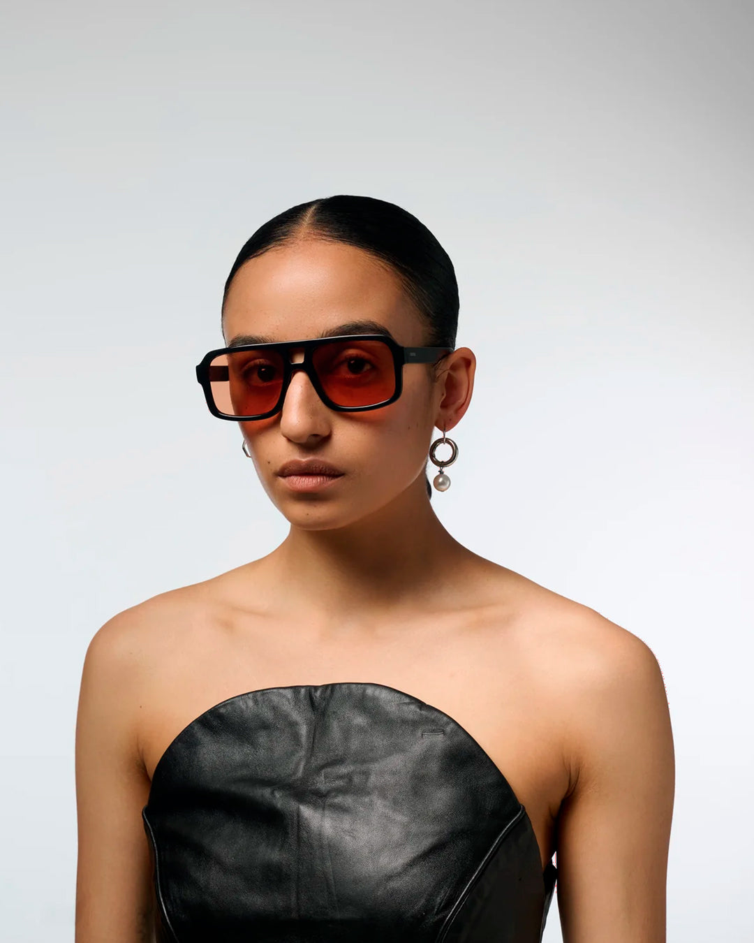 The Falcon strips things back to a slim rectangular frame with a lighter, sharper profile than KOMONO’s heavier acetate styles.