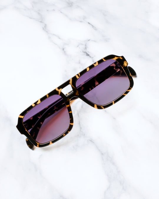 The Falcon strips things back to a slim rectangular frame with a lighter, sharper profile than KOMONO’s heavier acetate styles.