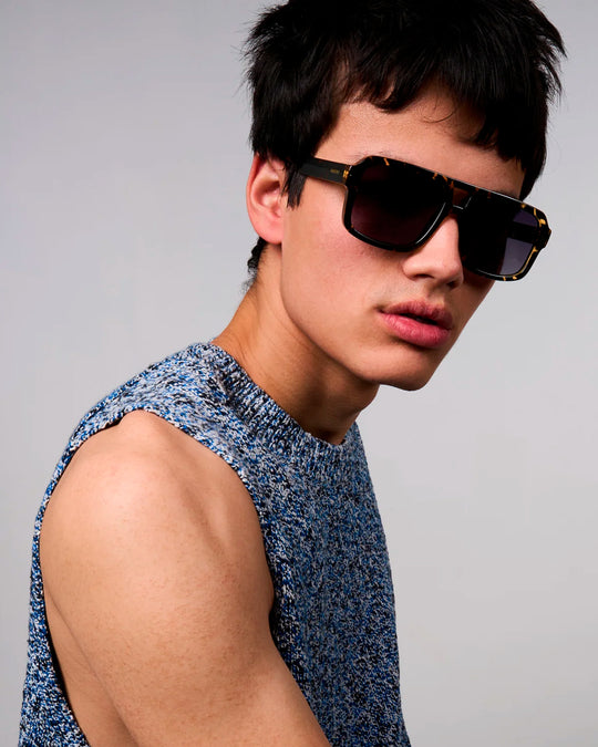 The Falcon strips things back to a slim rectangular frame with a lighter, sharper profile than KOMONO’s heavier acetate styles.