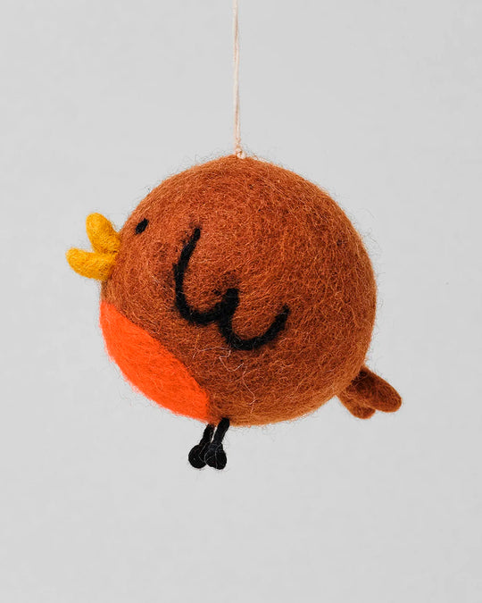 A cute and chirpy interpretation of the classic Red Robin at Christmas, a playful felted festive tree decoration designed by Holly St Clair.