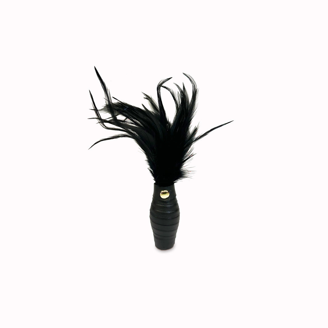 This exquisite accessory is designed to awaken your lover's senses with the gentle caress of luxurious black feathers. Its elegant design and luxurious feel make it a must-have for those seeking to elevate their intimate experiences.