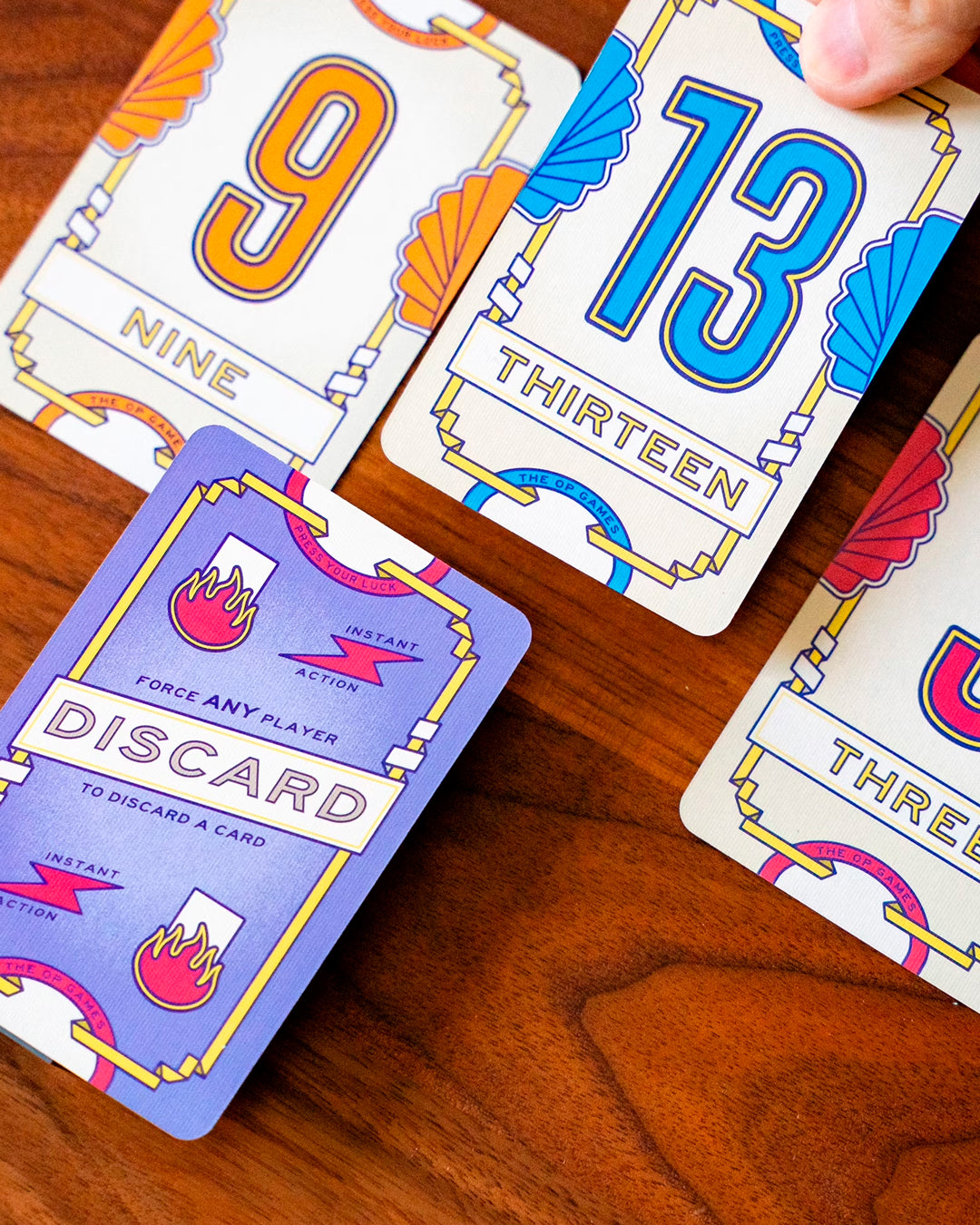 A standalone sequel to Flip 7, built around the same push-your-luck structure but with a sharper edge.