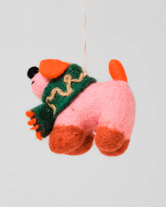 Cute, cuddly, and Christmassy - Flip the Dog with a festive green scarf! A playful felted Christmas tree decoration designed by Cari Vander Yacht.