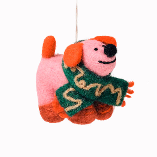 Cute, cuddly, and Christmassy - Flip the Dog with a festive green scarf! A playful felted Christmas tree decoration designed by Cari Vander Yacht.