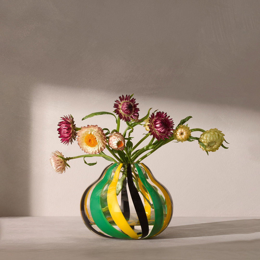 hand painted glass vase with black, green and yellow stripes for a contemporary folk inspired design. Painted by skilled artisans, each item will have subtle variations in pattern.