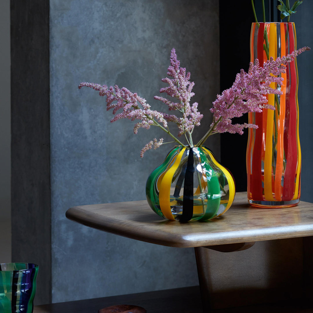 hand painted glass vase with black, green and yellow stripes for a contemporary folk inspired design. Painted by skilled artisans, each item will have subtle variations in pattern.