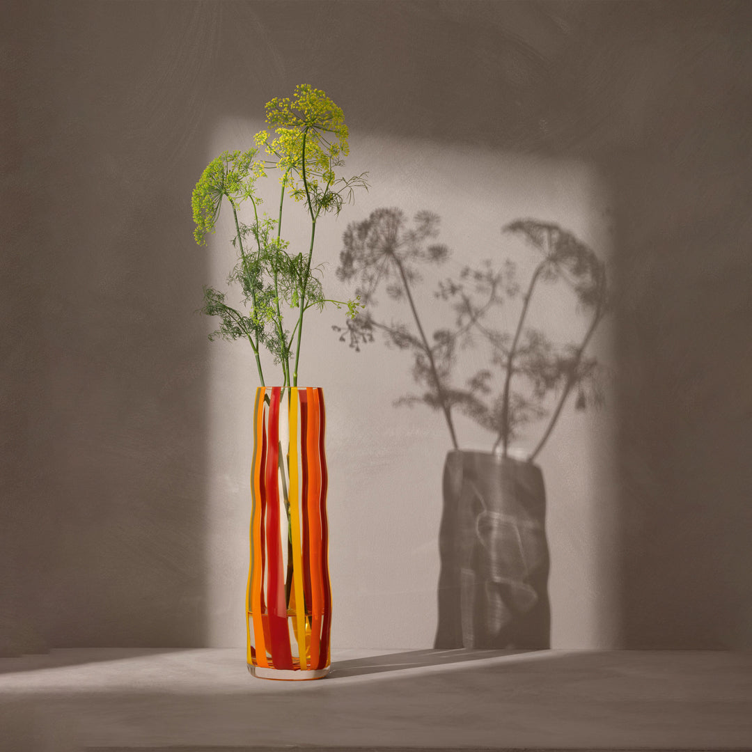 Part of the LSA International Folk Collection, this tall and slender glass Folk Vase has been hand painted with Orange, Red and Yellow stripes for bright and bold impact.&nbsp;