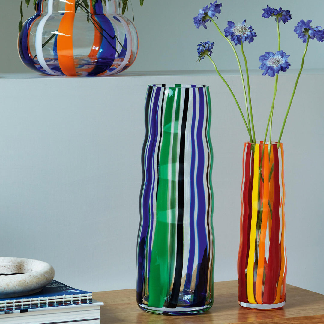 Part of the LSA International Folk Collection, this tall and slender glass Folk Vase has been hand painted with Orange, Red and Yellow stripes for bright and bold impact.&nbsp;