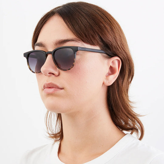 As worn by model, The Francis Black Tortoise offers unparalleled style and protection with a 139.5mm x 47.3mm Bio Nylon Frame, 100% UV400 lenses, and scratch-resistant PC lens. Featuring a frame that is matt black across the top and arms and tortoiseshell underneath paired with gradient smoke lenses, these sunglasses are both elegant and modern. 