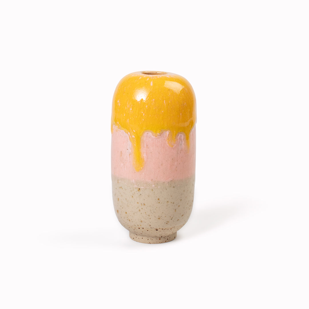 The Fruit Jelly Flux Mini Yuki Vase&nbsp;design is hand-thrown in watertight stoneware. Due to the rounded taper at the top of the vase, the glaze melts down the sides of the cylindrical vase mimicking melting ice.&nbsp;