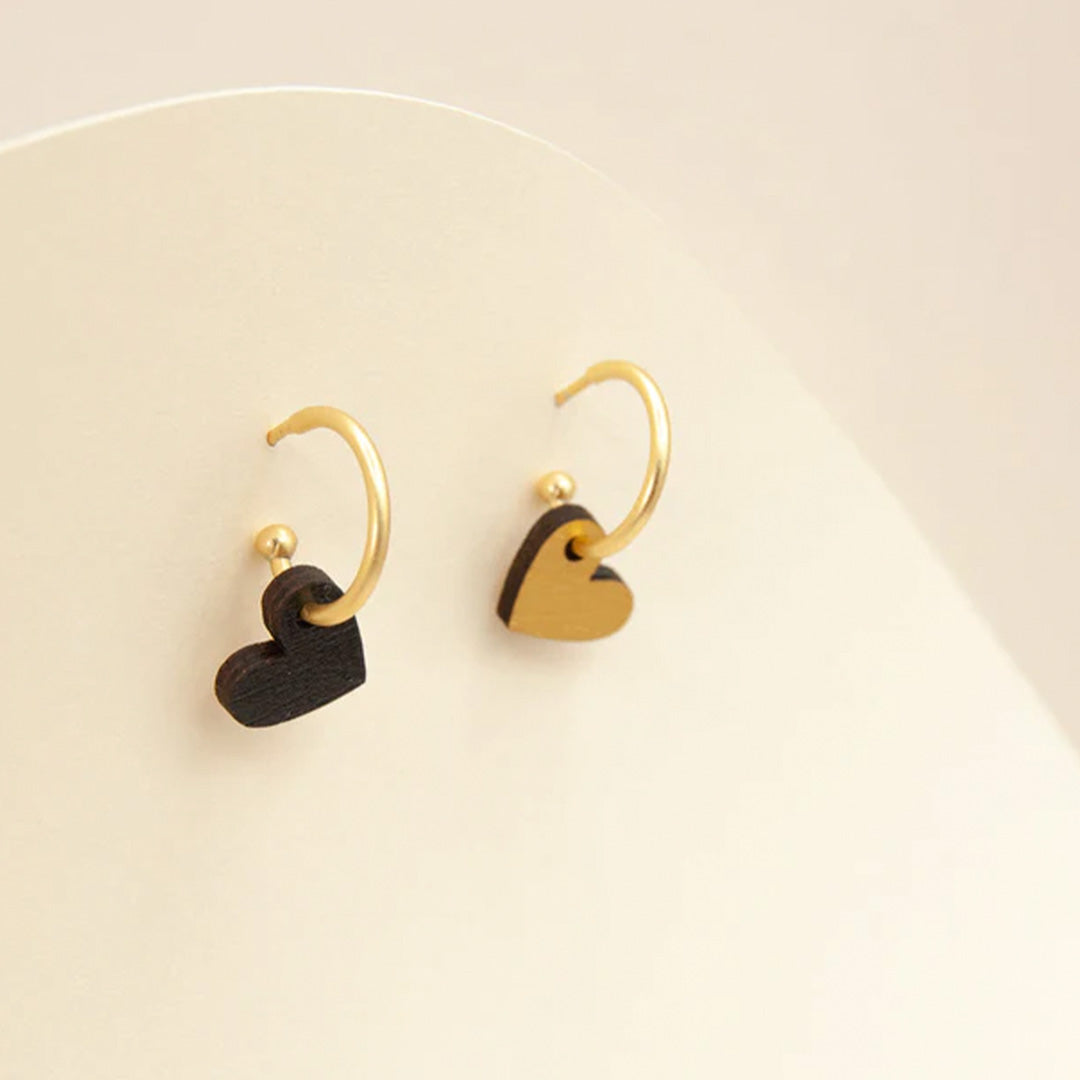 Hoop earrings by Materia Rica featuring red, gold and black hearts - pick which colour combination and how many hearts you want to wear.