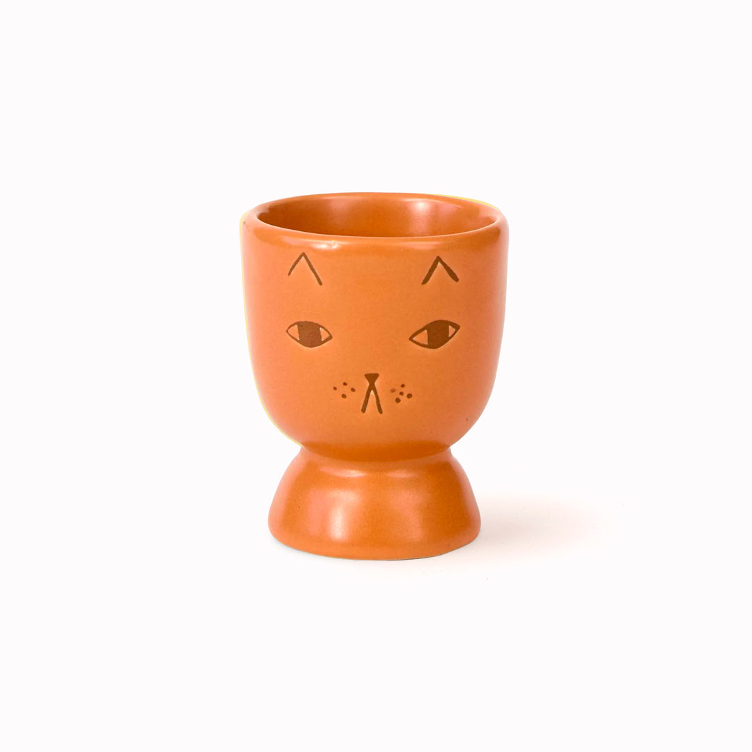 Stoneware Egg Cup with a ginger coloured glaze featuring her bestselling cute (if grumpy) cat face