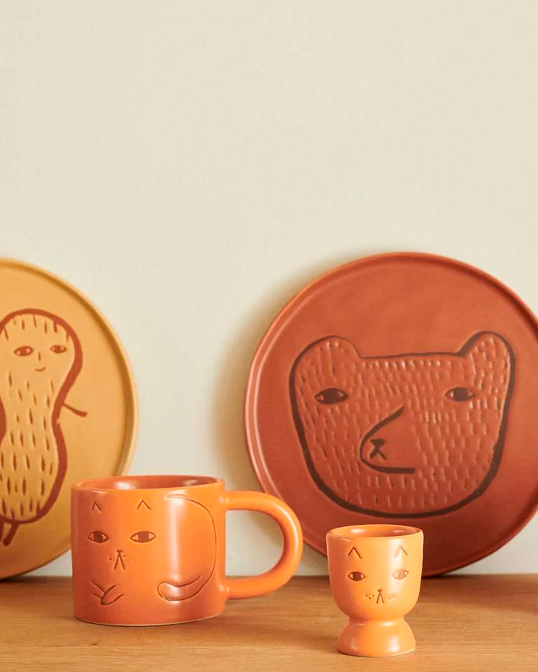 Stoneware Egg Cup with a ginger coloured glaze featuring her bestselling cute (if grumpy) cat face