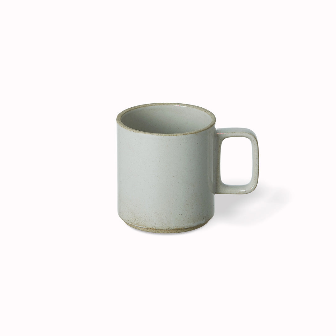 The medium gloss grey porcelain mug by Hasami Porcelain is a stackable mug for hot drinks such as tea or coffee.