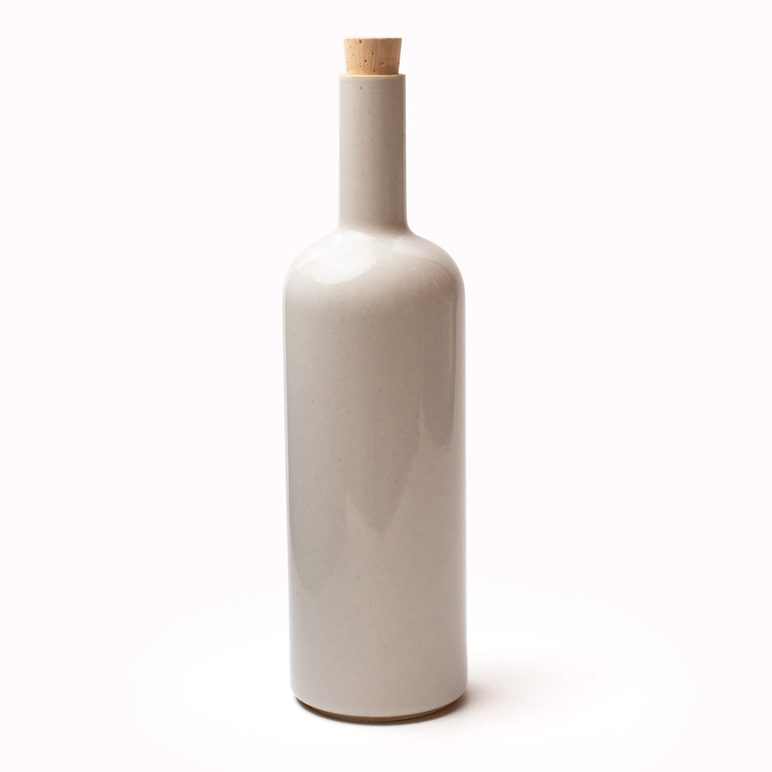 The gloss grey serving bottle by Hasami Porcelain is a modern Japanese minimal design beautiful porcelain bottle with cork stopper, suitable for use as a serving bottle for water at the dinner table, or for drizzling oil, or simply as a beautiful decorative object in its own right.