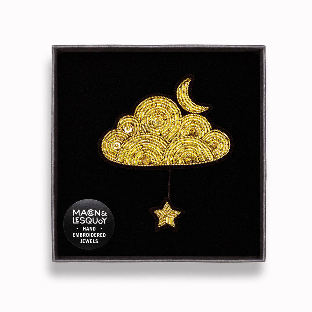 Hand-Embroidered Golden Cloud + Star by Macon &amp; Lesquoy – French Designed Statement Pin

Make a statement with this beautiful Gold Cloud With Moon and Star hand embroidered decorative lapel pin by Paris based Macon et Lesquoy