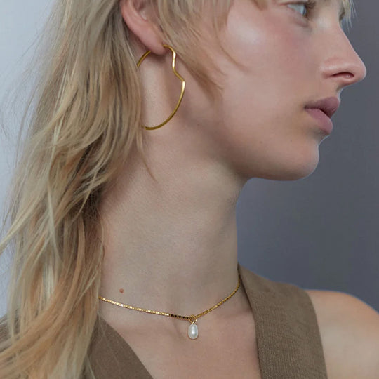 Gold as worn - The Peblinge Necklace is a fine example of Maria Black's commitment to creating versatile, sculptural jewellery. 