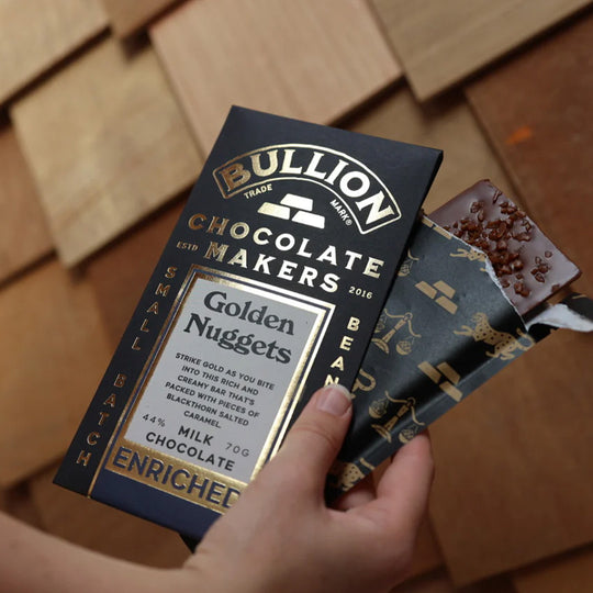 Bullion Chocolate - Golden Nuggets 70g bar in hand