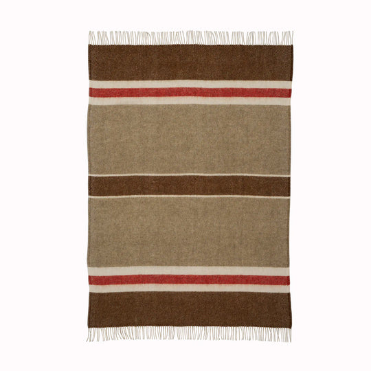 The 'Gotland Stripe' throw by Klippan in Red Stripe is a neutral cream and brown blanket with a hot red stripe. A warm and super soft throw to curl up under for a bit of added warmth