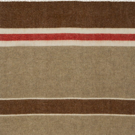 The 'Gotland Stripe' throw by Klippan in Red Stripe is a neutral cream and brown blanket with a hot red stripe. A warm and super soft throw to curl up under for a bit of added warmth