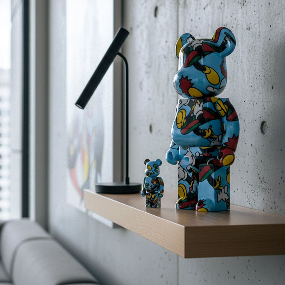 Grafflex Bearbrick 400% figurine on a wooden shelf with a modern interior background
