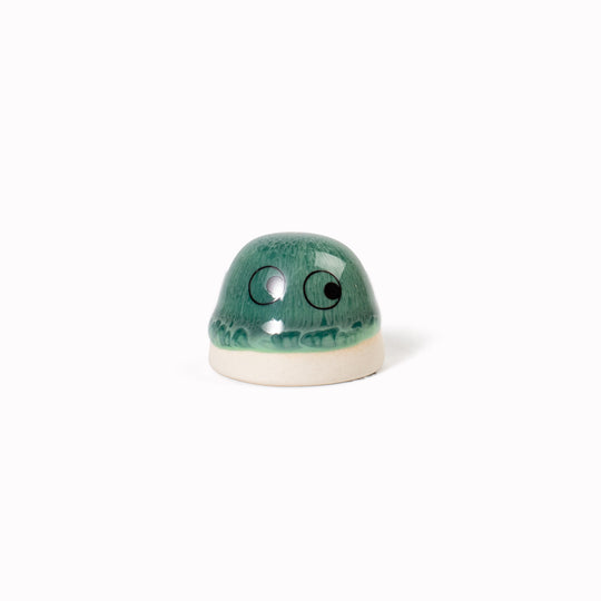 Inspired by Japanese Shinto beliefs that all objects have a soul each Familia Dot member is given life with a cute pair of eyes. They are hand-cast in solid, heavy white porcelain