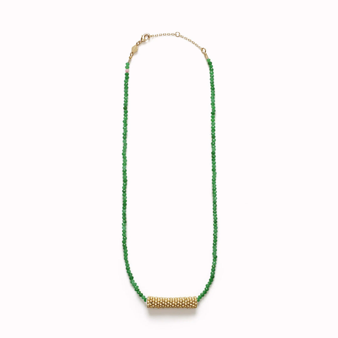 he Green Jade Tan Line Necklace by Anni Lu is a stunning piece crafted in brass with 18-karat gold plating and e-coating