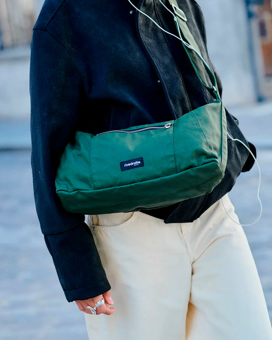 The Mini Charlot is a compact shoulder bag large enough for all your daily essentials. For AW26 the bag is made from a 100% organic cotton canvas fabric with a water resistant coating