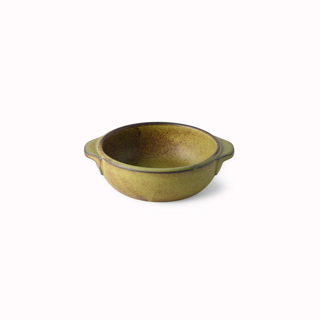 A hand finished Japanese contemporary over proof dish featuring handles with a green glaze.