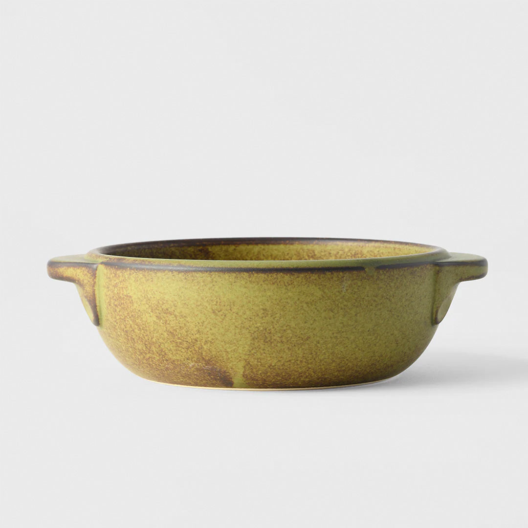 A hand finished Japanese contemporary over proof dish featuring handles with a green glaze.