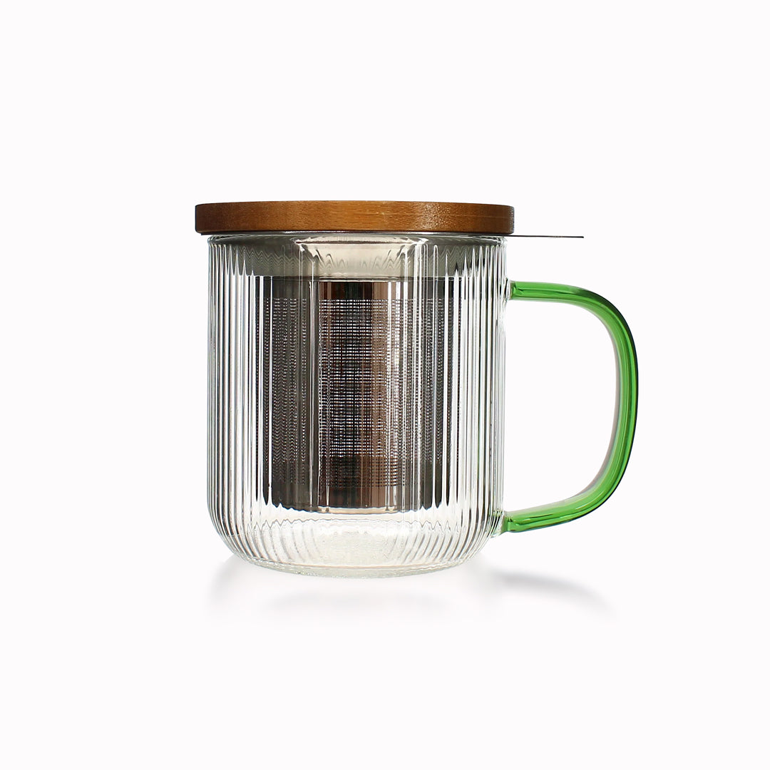 Tea for one in a borosilicate glass teapot mug with graphite grey handle, by French brand Ogo Living. Topped with a wooden lid to keep your tea warm while it brews.