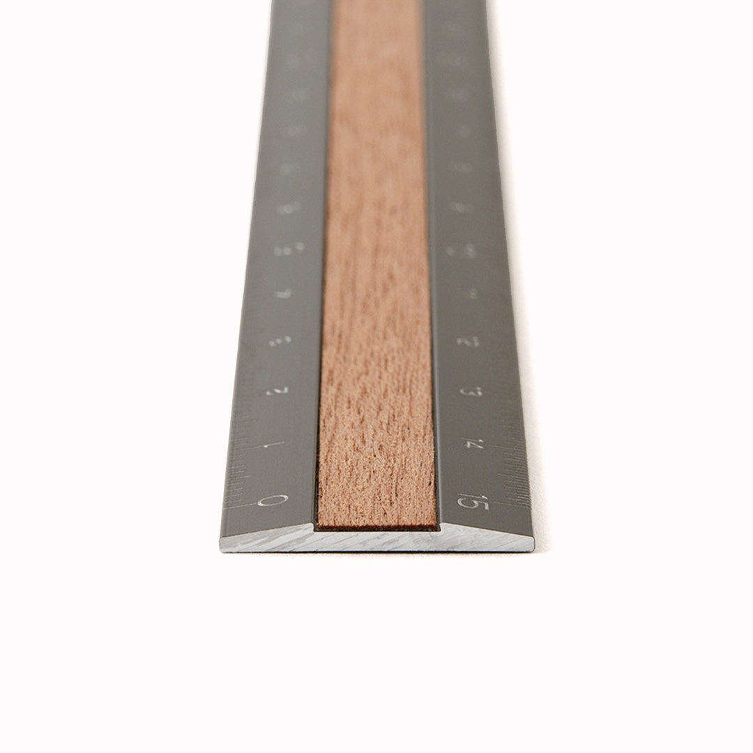 A stylish grey aluminium and bamboo ruler from Japanese stationery brand, Midori.&nbsp;This 15cm ruler features a laser etched scale in 1mm and 0.5mm and is easy to read being engraved on grey. Hardwearing and stylish with the added advantage of fitting in your pencil case.
