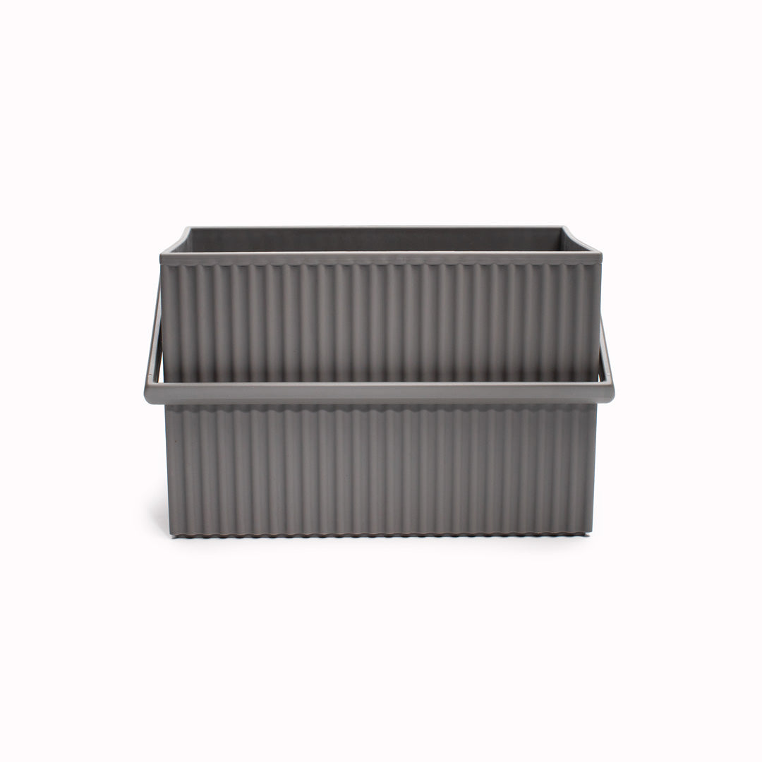 Grey coloured homeware stacking box with matching grey carry handles.