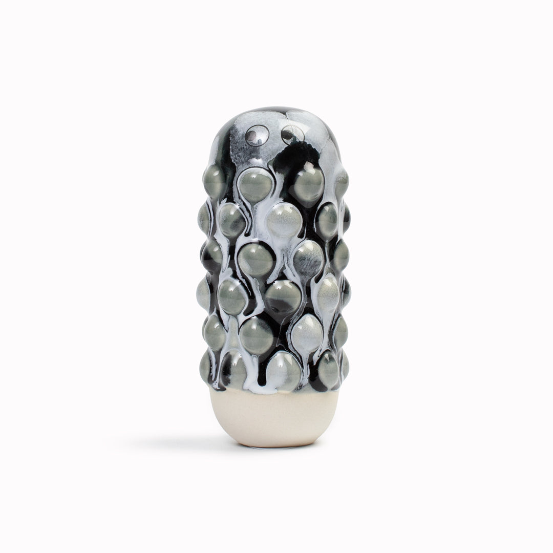 Meet Mimi! Mimi is a barnacle encrusted, bobbly, hand glazed ceramic figurine created as a close relative of the classic Arhoj Ghost. 